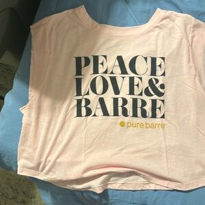 One Pure Barre pink tank and one Pure Barre black tank